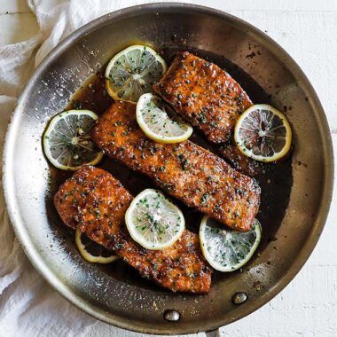 pan with salmon fillets and lemon