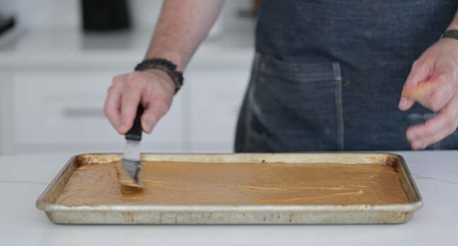 spreading batter across a sheet tray