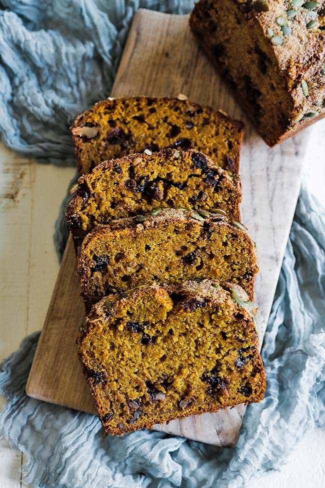 sliced pumpkin bread on a cutting board