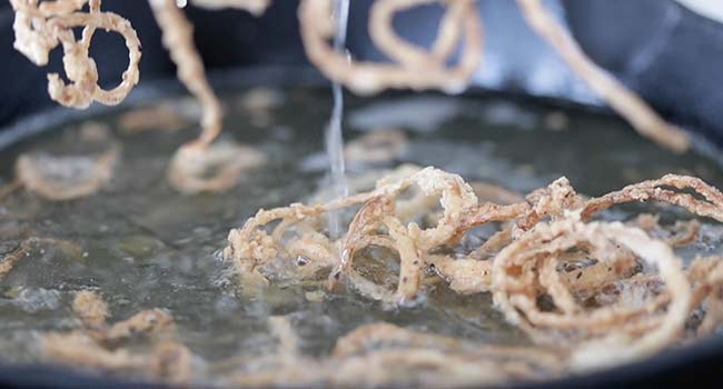 fried onion straws in oil