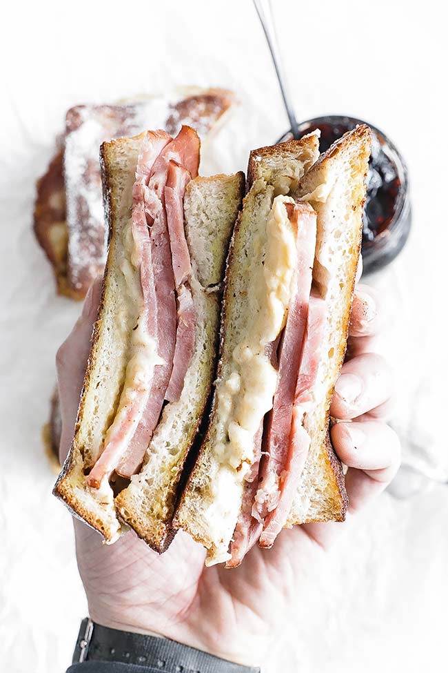 monte cristo sandwich in hand with jam