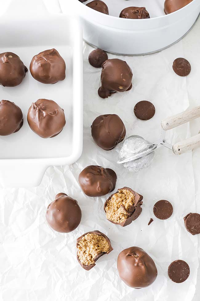 chocolate peanut butter balls in a cookie tin