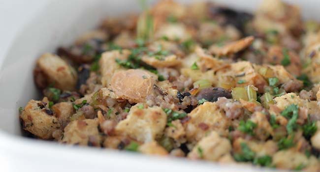 garnishing stuffing with fresh chopped herbs