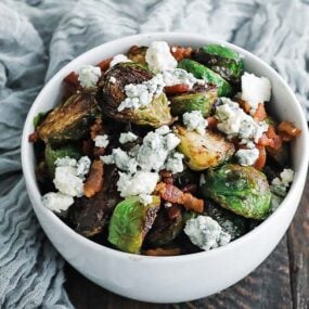 bowl of brussels sprouts with blue cheese and bacon