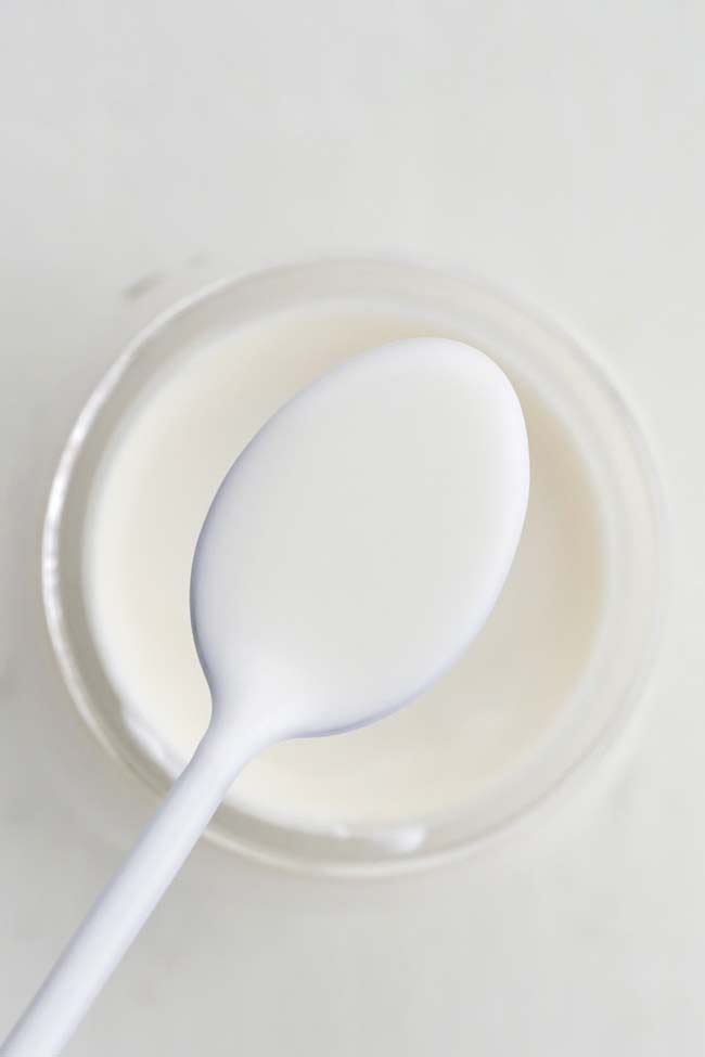 spoonful of creme Fraiche from a jar