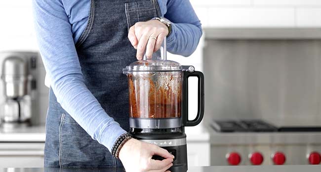 mixing together ingredients in a food processor