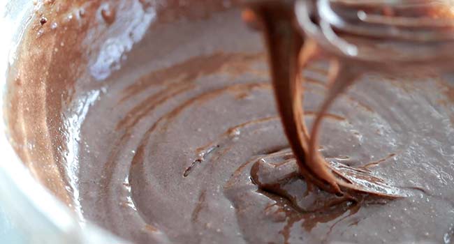 whisking together a chocolate batter