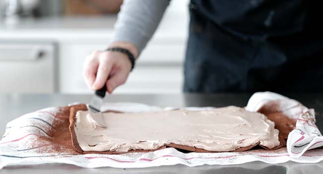 spreading filling onto a sheet cake