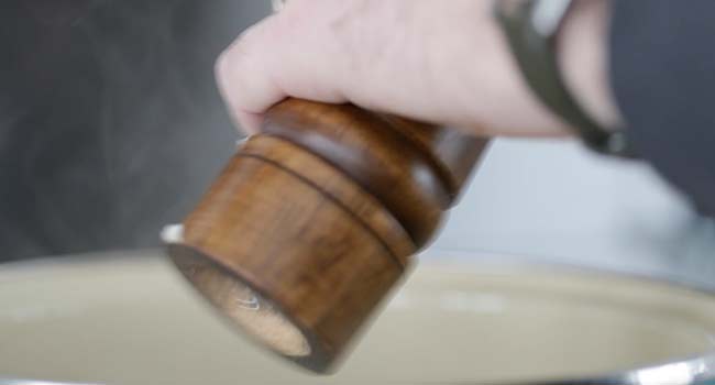 seasoning the avgolemono soup with pepper