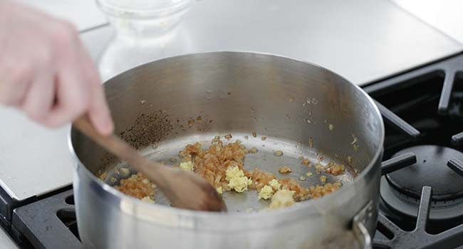 cooking ginger with garlic and onions