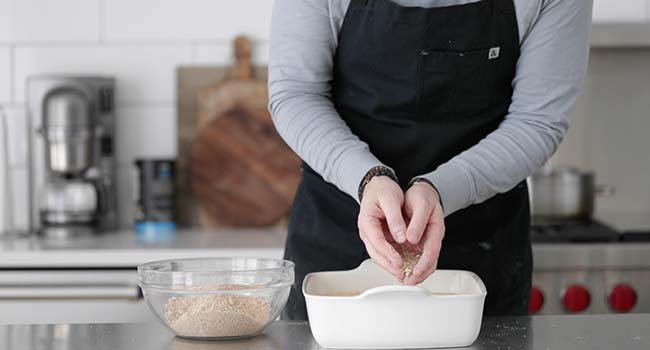 adding streusel to a coffee cake