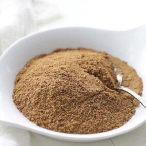 garam masala powder recipe with a spoon on a plate