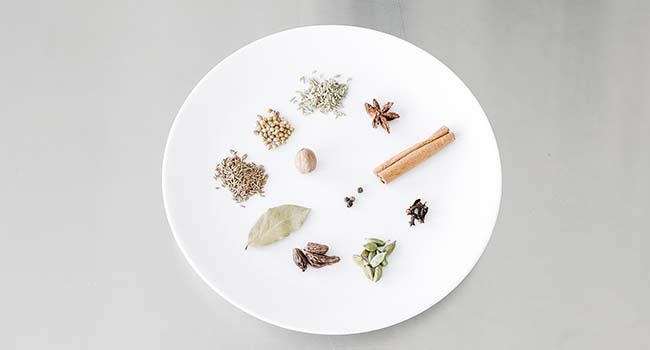 spices on a plate that make up garam masala