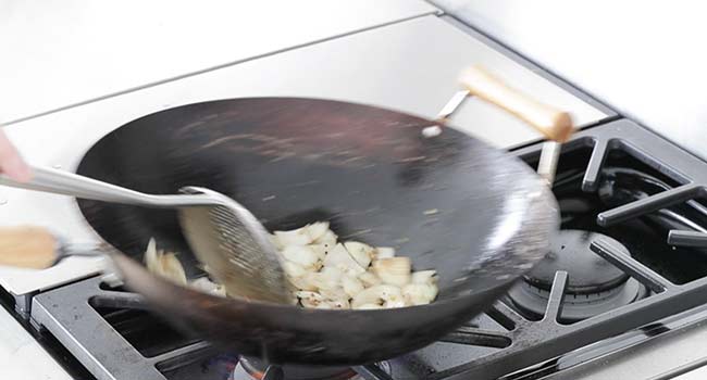 stir frying sliced onions