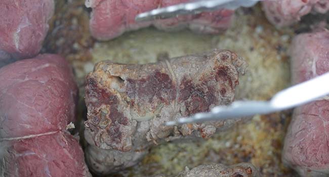 pan searing roulade beef in a pan