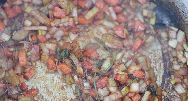 cooking mirepoix in a pan