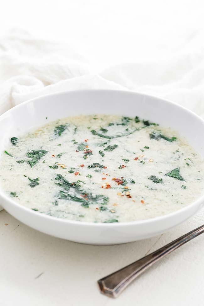 bowl of stracciatella soup with spinach