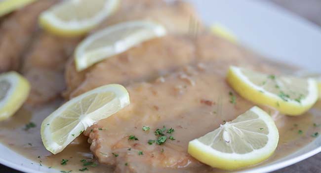 garnishing chicken francese with parsley