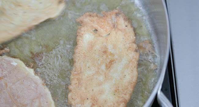 cooking battered chicken breast in hot oil