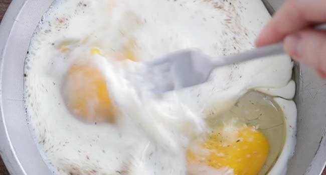 whisking eggs with buttermilk