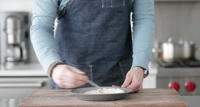 whisking seasoned flour together