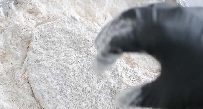 dredging pork chops in flour