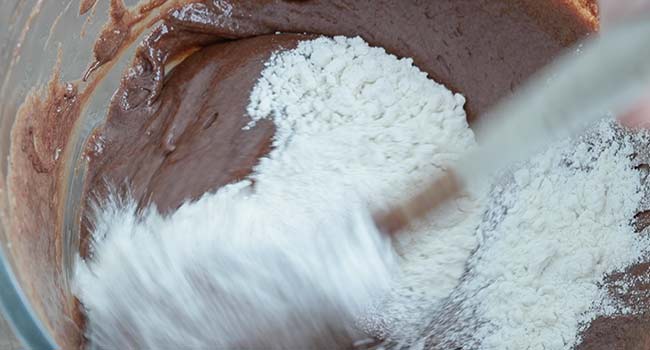 mixing flour to a chocolate batter