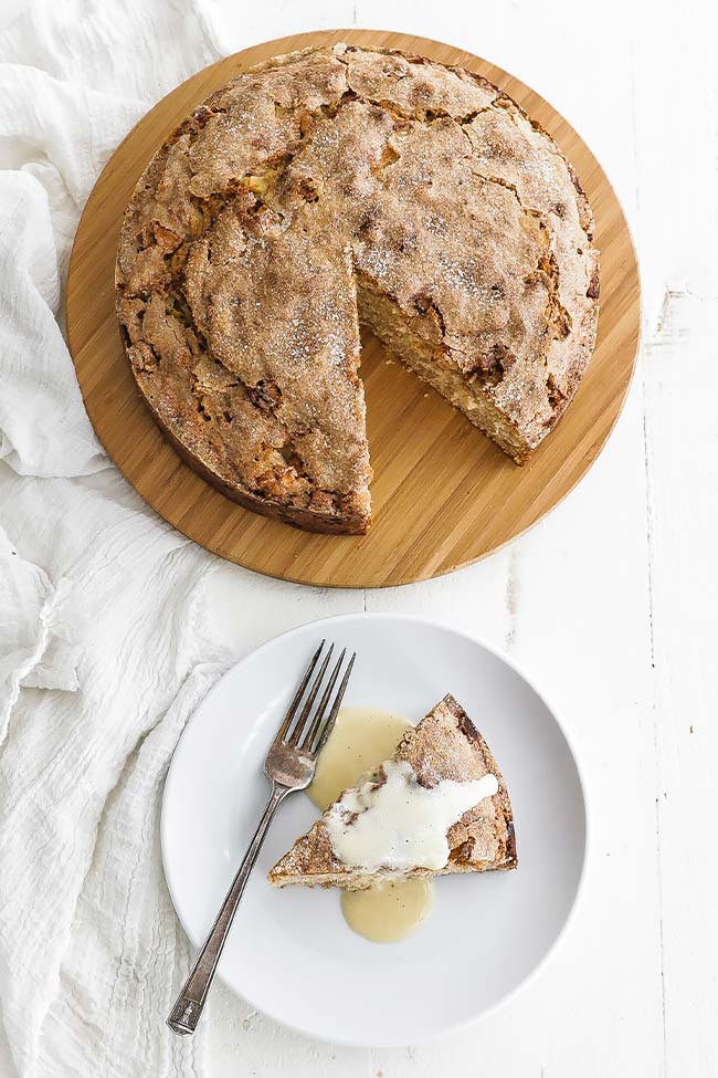 Irish apple cake with a slice and custard sauce