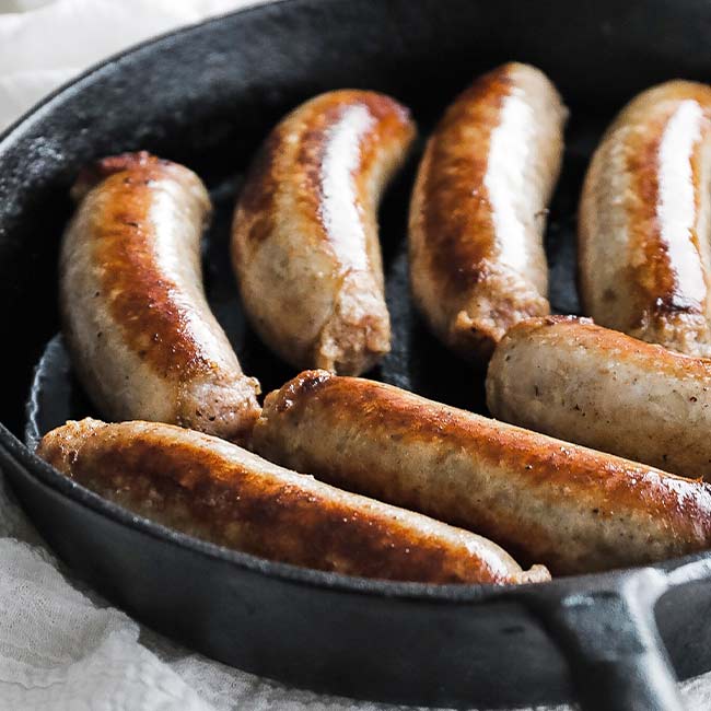 cooked bangers in a pan