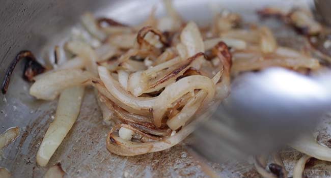 cooking onions in a pan