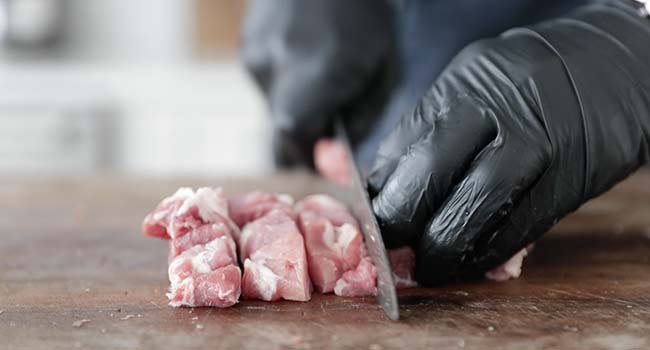 cutting up pork