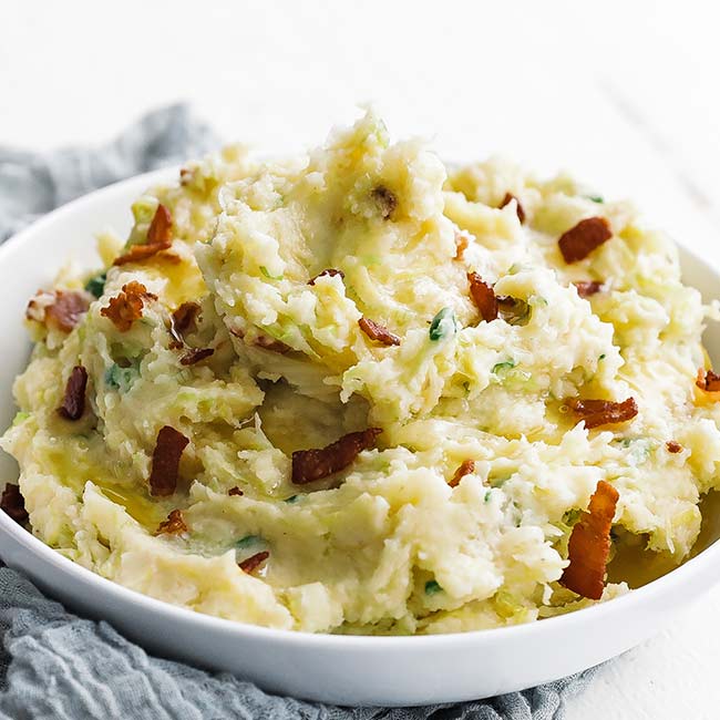 bowl of irish colcannon with bacon