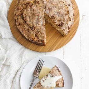 Irish apple cake with a slice and custard sauce