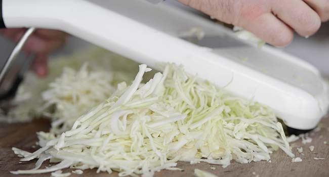 thinly slicing cabbage