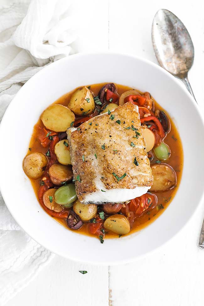 pan seared chilean sea bass on mediterranean style vegetables