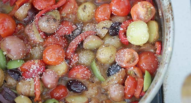 adding fresh basil to vegetables