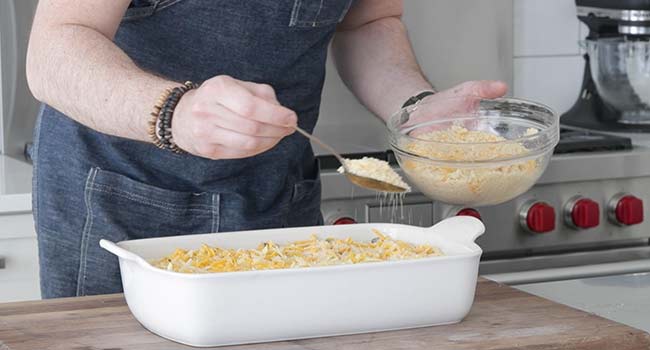 sprinkling breadcrumbs on top of tuna casserole