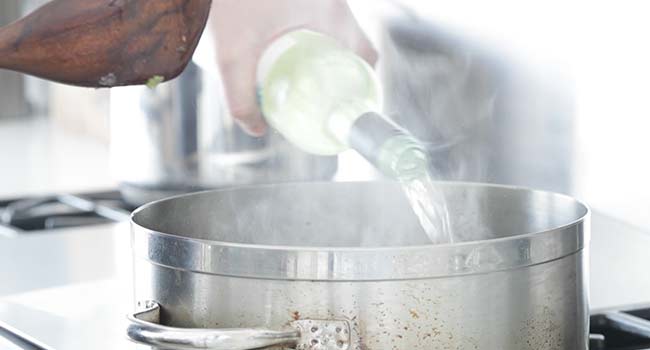 deglazing a pan with white wine