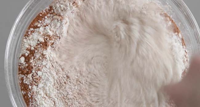 whisking dry ingredients together in a bowl