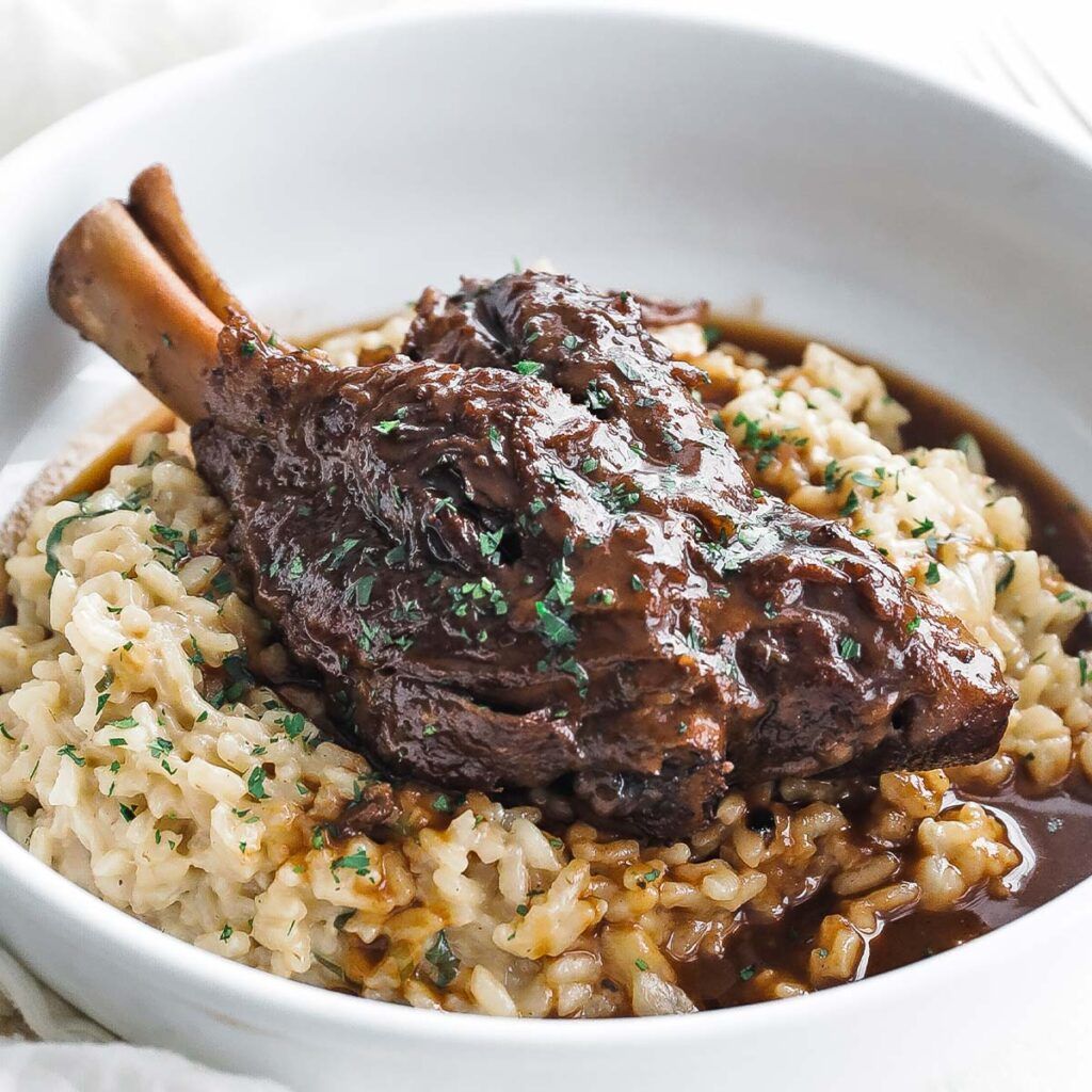 braised lamb shank with risotto in a bowl