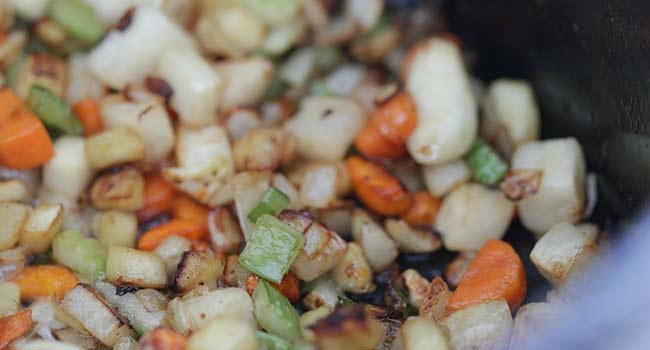 caramelizing vegetables in a pot