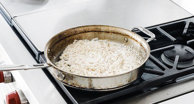 frying rice in a pan