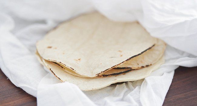 corn tortillas alongside picadillo