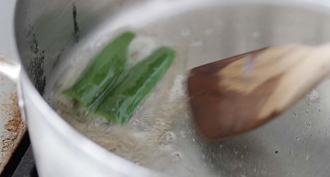 searing a serrano pepper in bacon fat