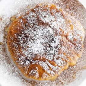 sopapilla on a plate with honey