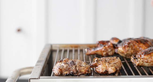 flipping grilled chicken