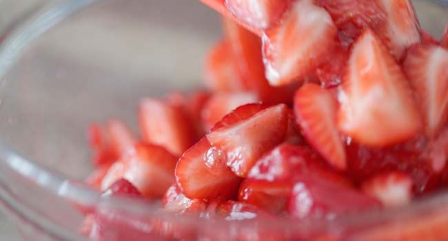 mixing fresh strawberries