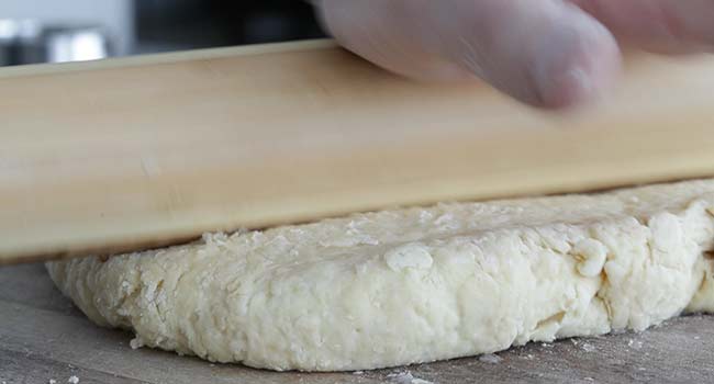 rolling out dough on a surface