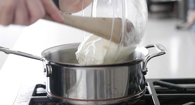 adding yogurt to a pot