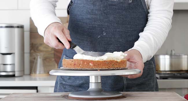 icing a cake with buttercream